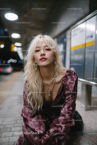 Stylish Young Woman with Blonde Hair in Urban Subway Scene