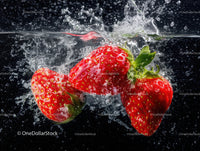 Fresh Red Strawberries Splashing into Water in Close-Up