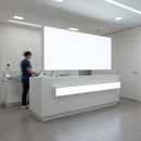 Medical professional working in modern clinical reception area