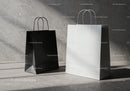 Black and white shopping bags on concrete floor