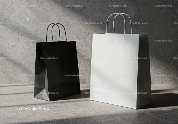Black and white shopping bags on concrete floor JPG Mockup Image