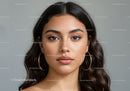 Close-Up Portrait of a Beautiful Young Woman with Brown Hair and Earrings