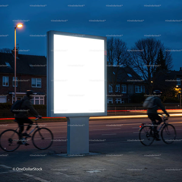Empty Illuminated Billboard by Road with Cyclists at Dusk JPG Mockup Image