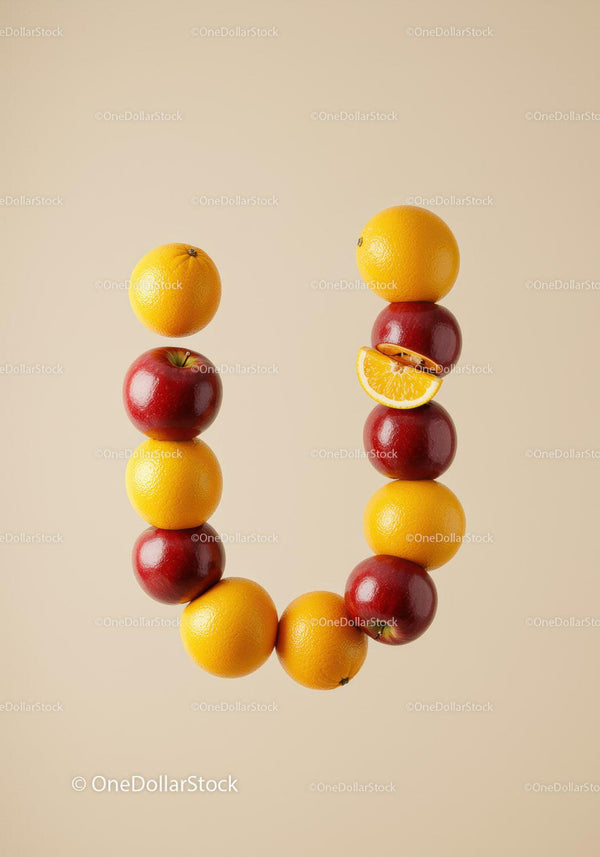 Creative U shaped letter made of apples and oranges