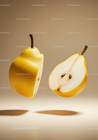 Two halves of a fresh yellow pear floating