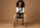 Stylish Confident Woman Sitting on Chair in Modern Studio