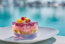 Colorful Fruit Jelly Dessert with Fresh Fruit Toppings by Pool