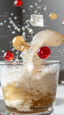 Splash of Carbonated Drink with Bubbles and Cherry in Glass