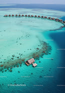 Overwater Bungalows in Turquoise Lagoon Scene with Scenic Ocean View