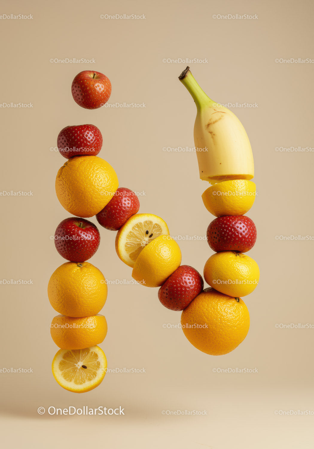 Creative arrangement of fresh fruits forming letter N