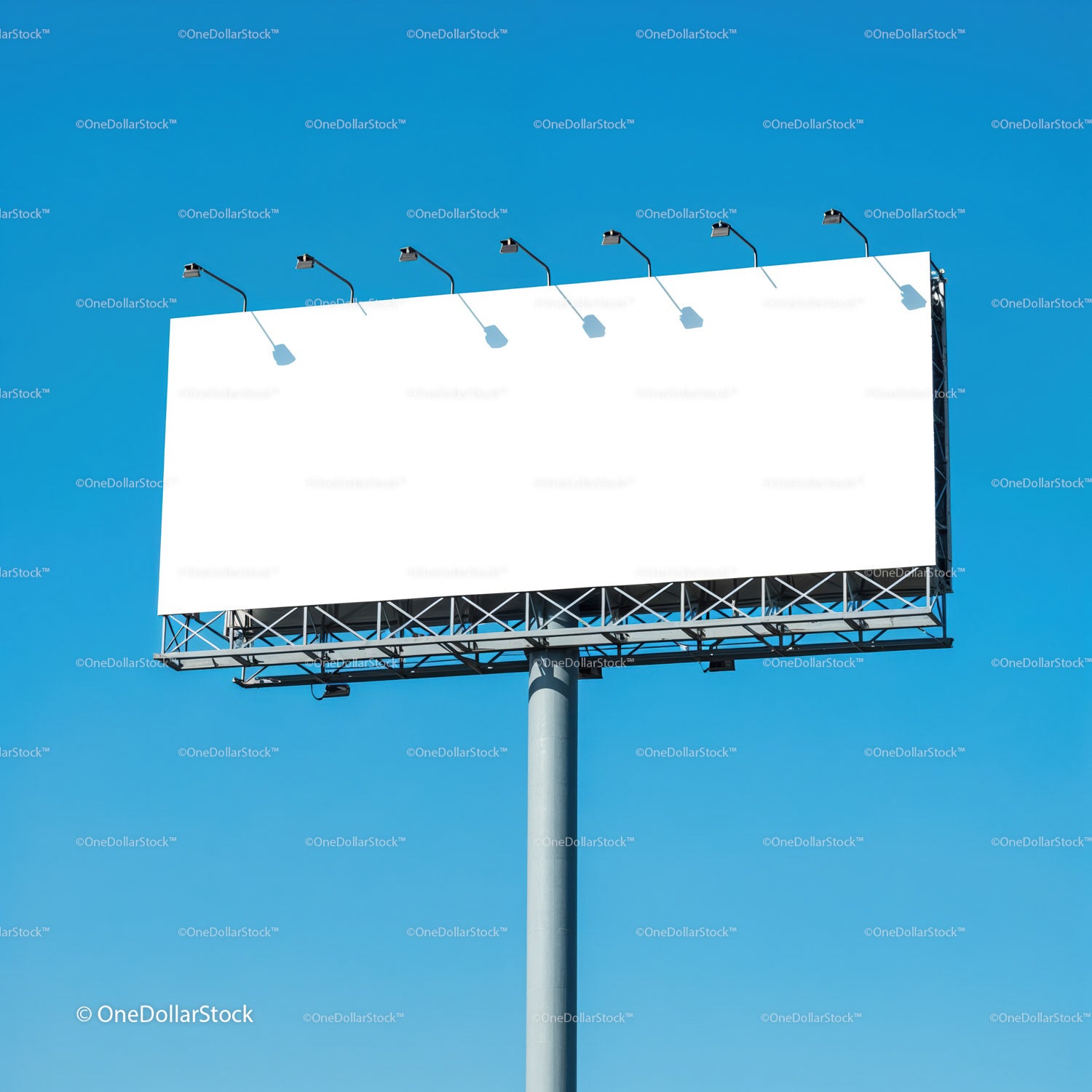 Large blank billboard against clear blue sky