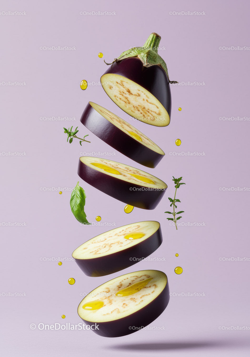Sliced eggplant with olive oil and fresh herbs floating