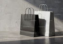 Minimalist Black and White Shopping Bags on Concrete Floor