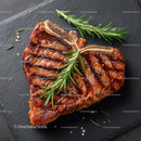 Juicy Grilled Steak with Rosemary on Black Slate Plate