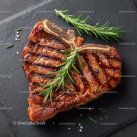 Juicy Grilled Steak with Rosemary on Black Slate Plate
