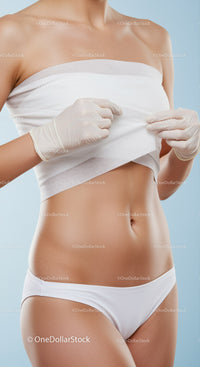 Healthy Toned Woman Lifting White Top Showing Abs and Skin