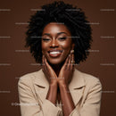 Portrait of a Smiling African American Woman with Natural Curly Hair in Studio
