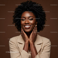 Portrait of a Smiling African American Woman with Natural Curly Hair in Studio