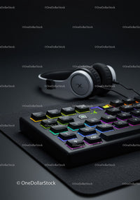 RGB Backlit Gaming Keyboard with Wireless Headset on Modern Desk