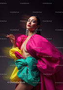 Fashion Model in Vibrant Pink and Yellow Flowing Gown