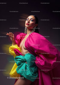 Fashion Model in Vibrant Pink and Yellow Flowing Gown