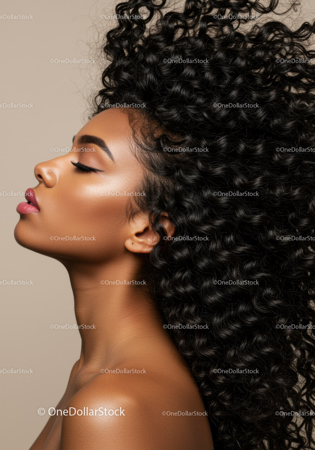 Portrait of serene woman with voluminous curly hair