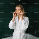 Young Woman Applying Gold Eye Patches During Skincare Routine