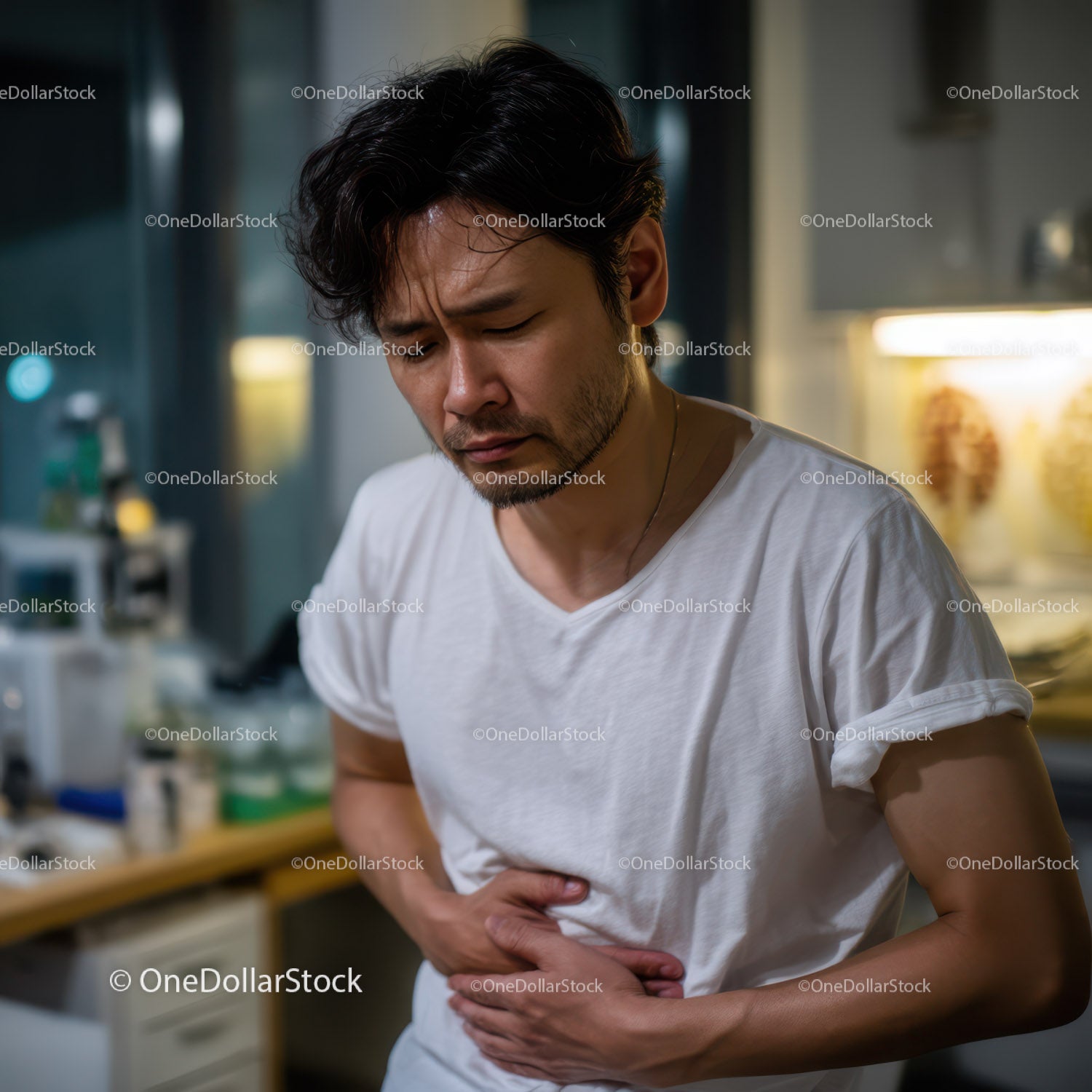 Man Experiencing Abdominal Pain in Casual Indoor Setting