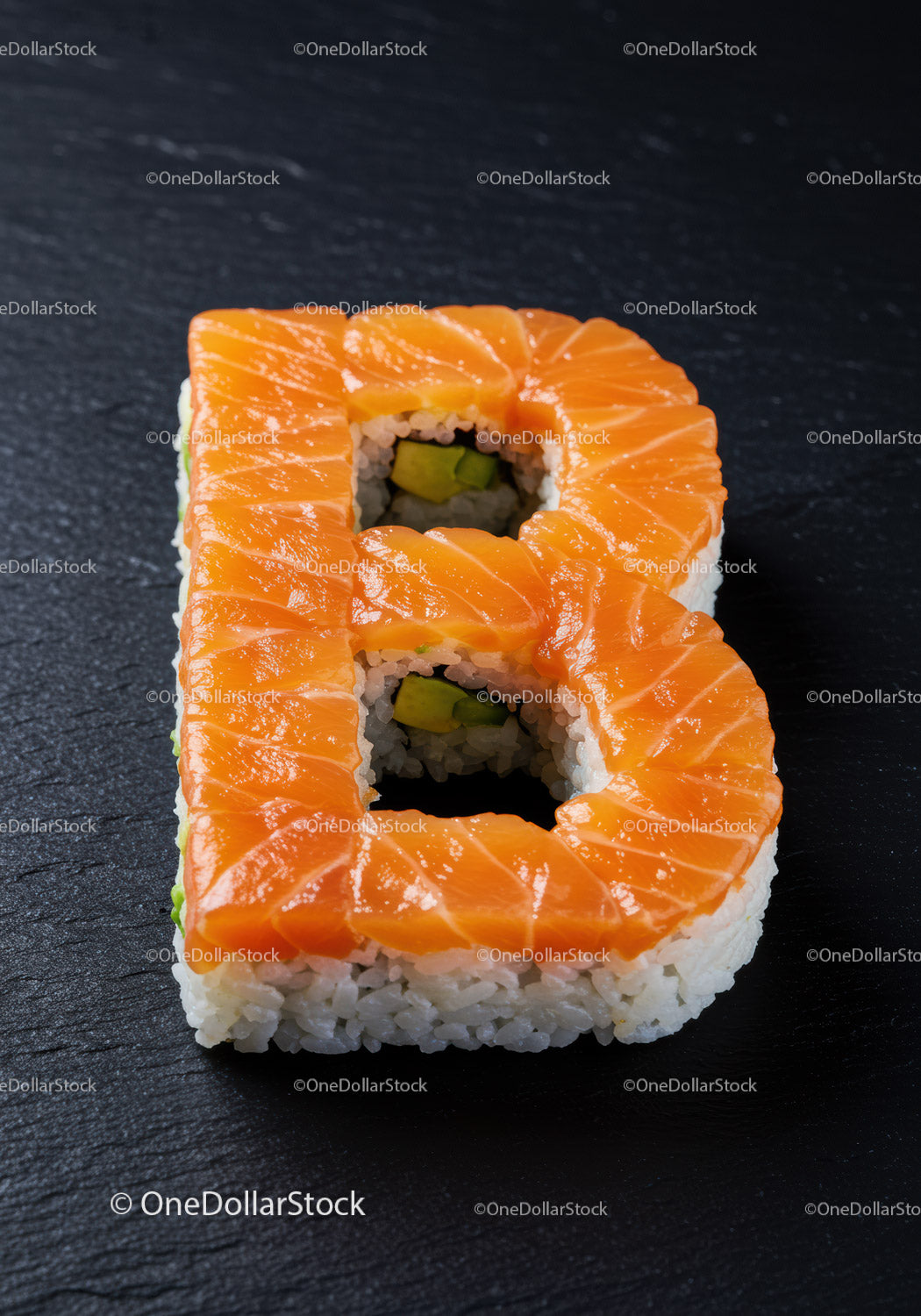 Creative salmon sushi roll shaped as letter B