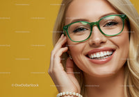 Smiling woman wearing green glasses with pearl bracelet
