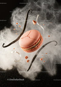 Pink macaron with vanilla pods and flour dust explosion