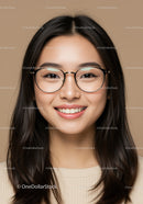 Young Woman Wearing Glasses with Bright Smile and Warm Background