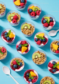 Colorful yogurt parfaits with fresh fruit and granola