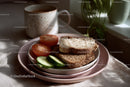 Fresh Wholegrain Bread with Sliced Cucumber and Tomato on Pink Plate