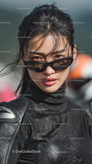 Confident Woman in Black Outfit with Sunglasses Outdoors