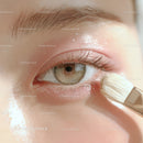 Close-up of Eye with Subtle Makeup and Makeup Brush Showing Skin Texture