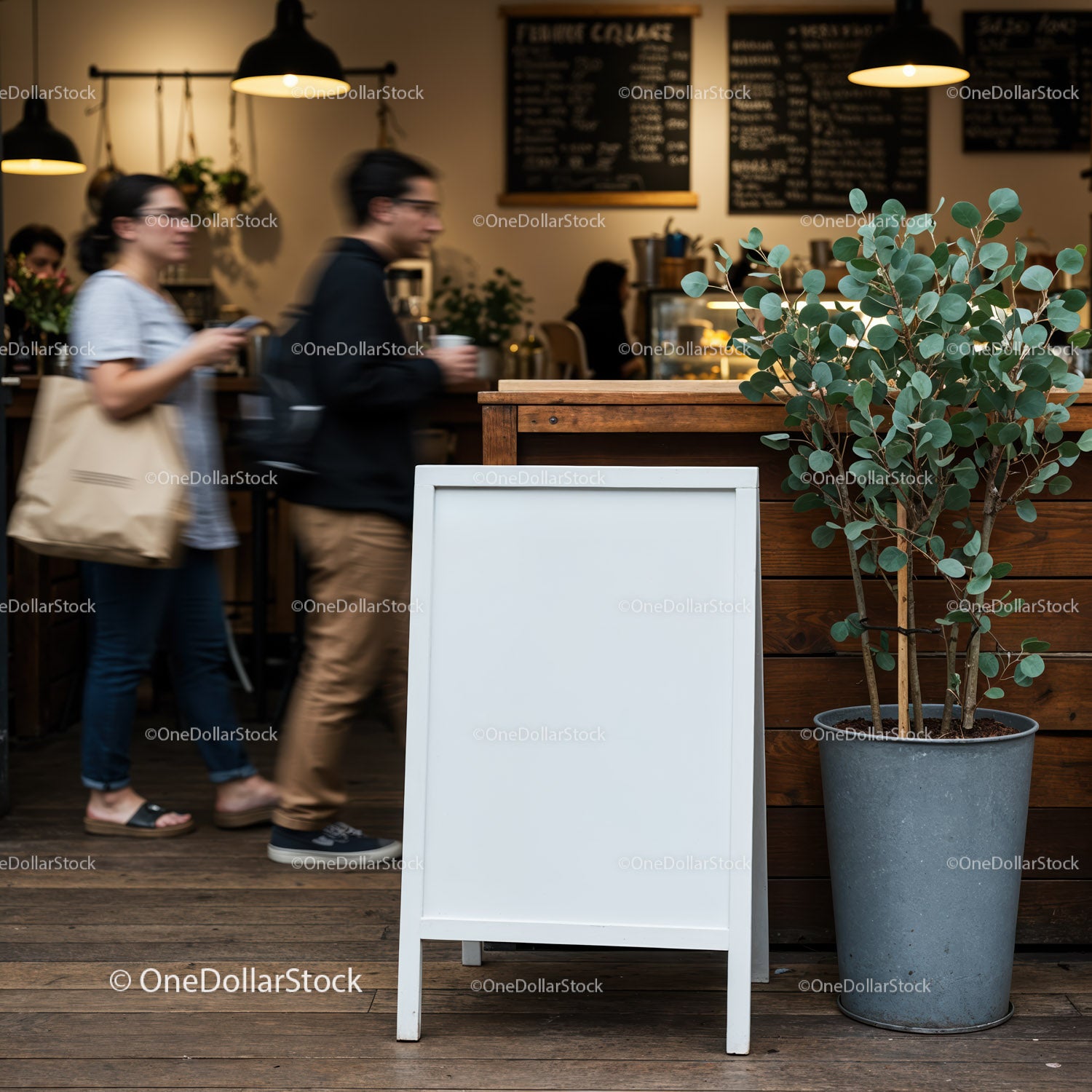 Blank chalkboard stand outside busy coffee shop interior
