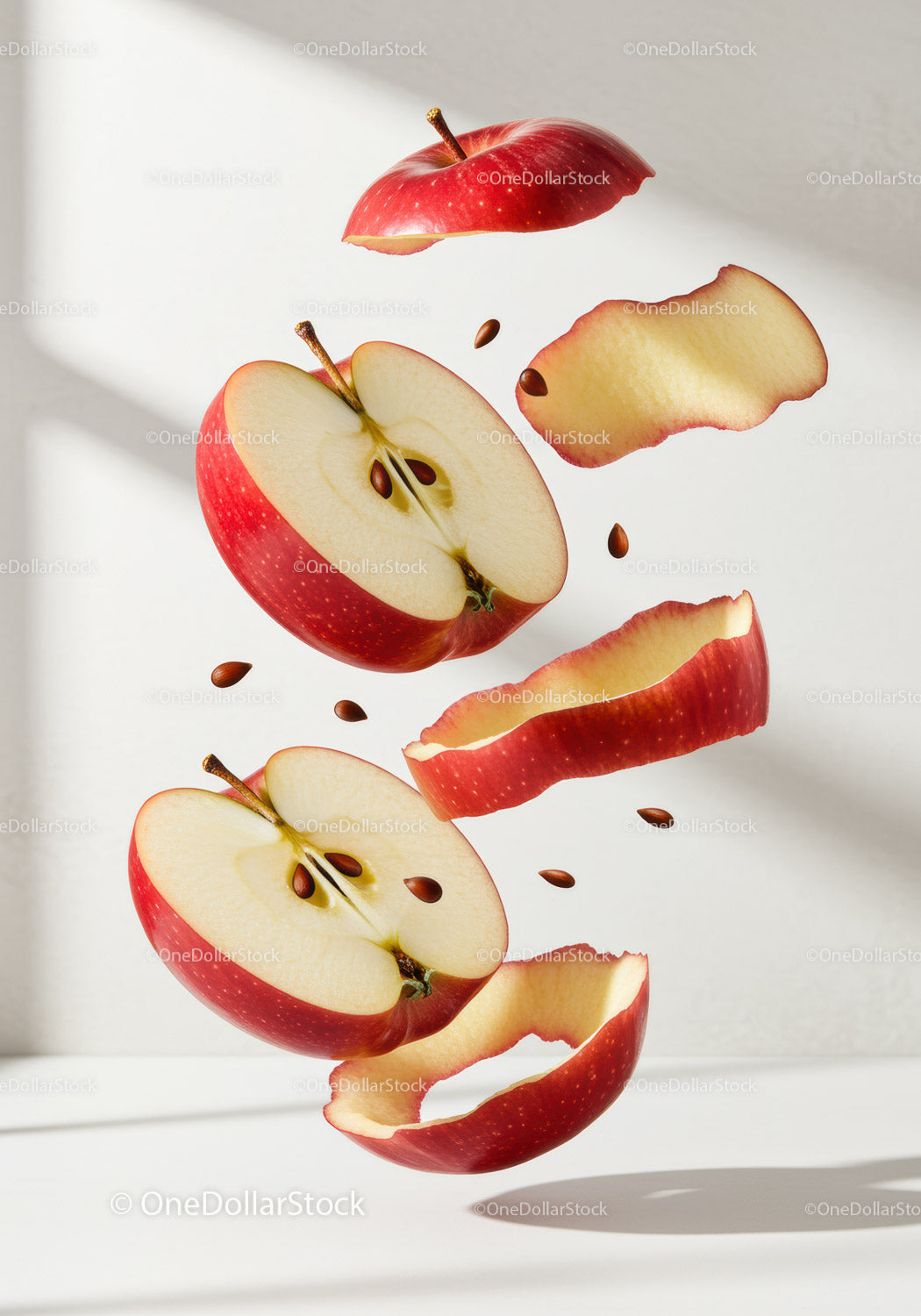 Floating Red Apple Halves with Peels and Seeds