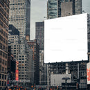 Urban cityscape with large blank billboard tower