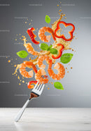 Fresh shrimp with red pepper and basil on fork splash