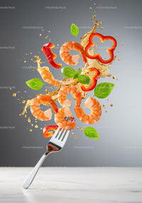 Fresh shrimp with red pepper and basil on fork splash