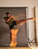 Athlete executing a high flying kick with dynamic motion