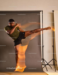 Athlete executing a high flying kick with dynamic motion
