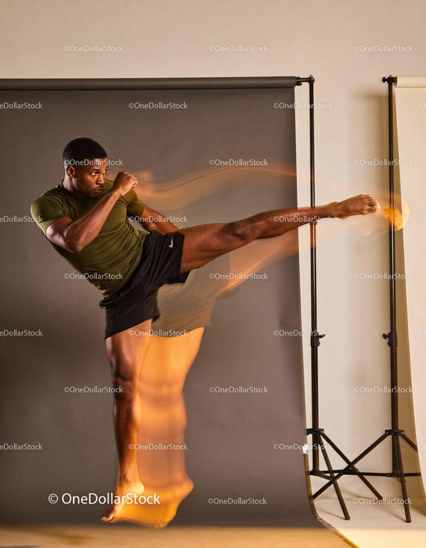 Athlete executing a high flying kick with dynamic motion