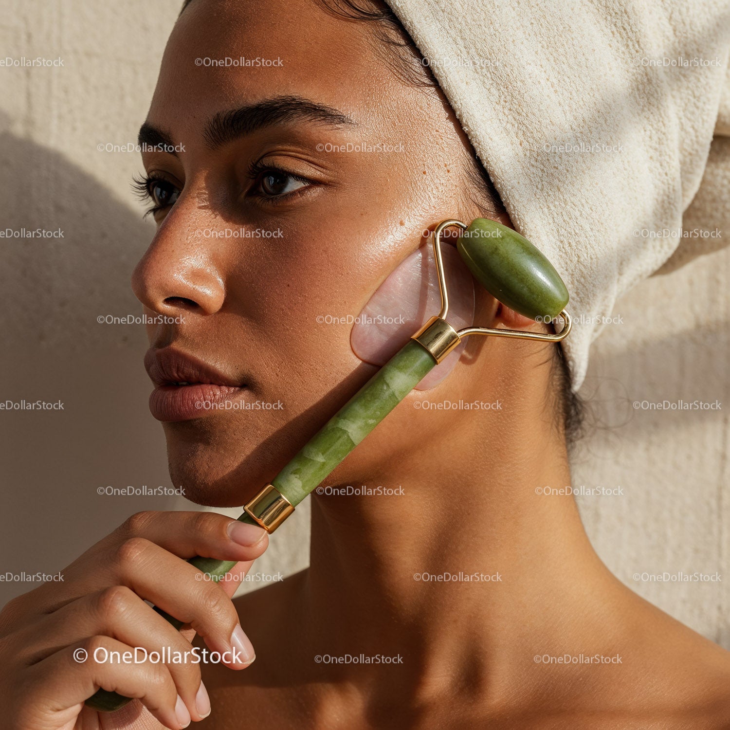 Young Woman Receiving Facial Massage with Jade Roller for Glowing Skin