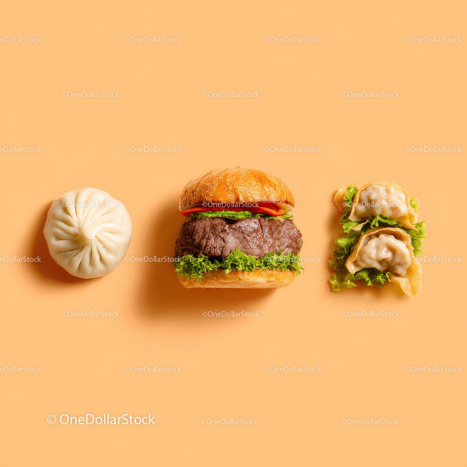 Gourmet Burger with Lettuce and Tomato Next to Grilled Steak and Dumpling