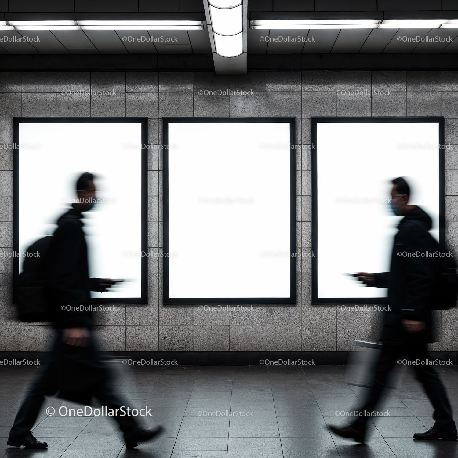 Blurred commuters walking past subway ad panels