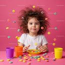 Curly-haired child playing with colorful cereal on pink table