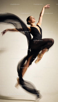 Graceful ballet dancer captured in elegant leap
