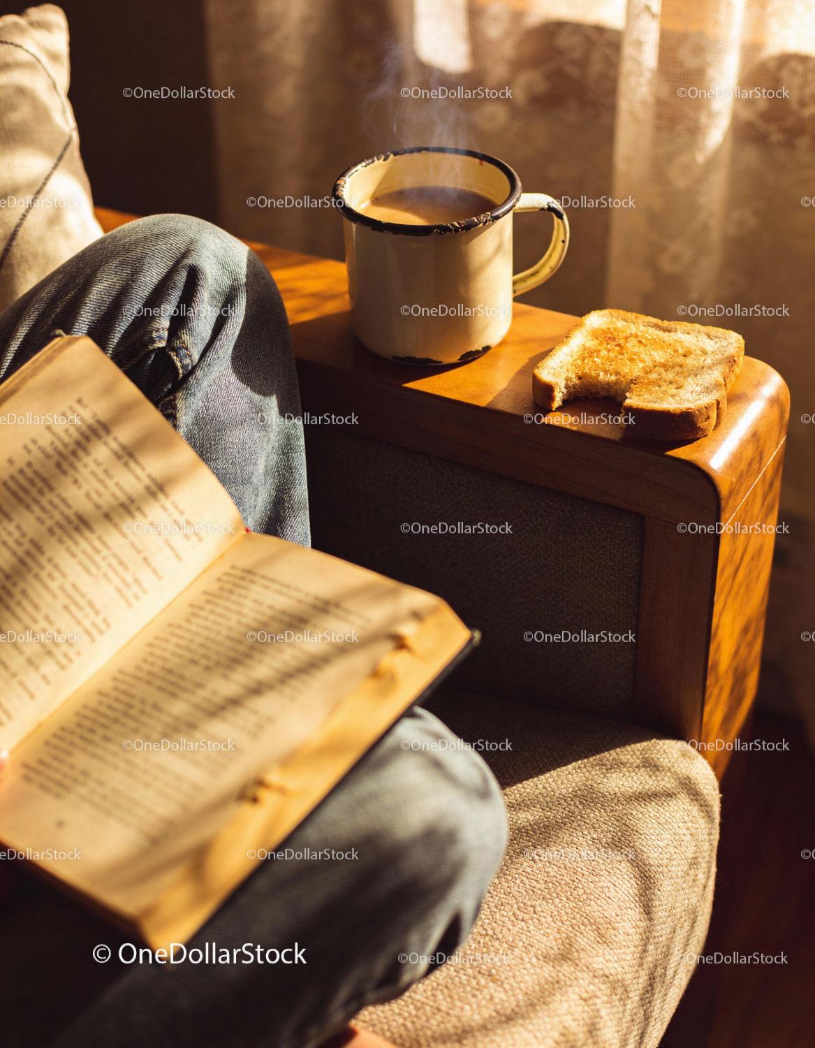 Cozy morning reading with coffee and toasted bread